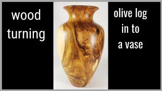 Wood turning a olive log in  to a vase