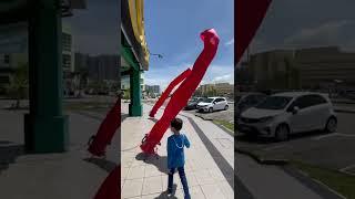 Double dancing air dancer in front of a shop