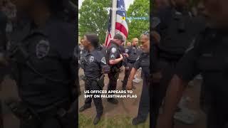 US police officer appears to be spitting on Palestinian flag