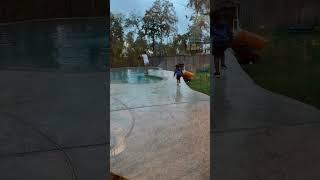 Dad gives son giant lollipop to push mom in the pool #shorts