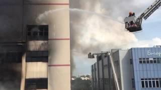 SCDF personnel using water jets on the C K Building fire