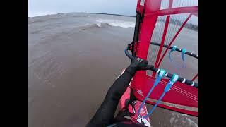 Windsurfing in stormy cold weather