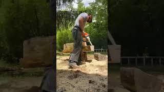 Chainsaw carved dog in the works