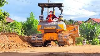 Dozer Operator and Big Truck develop rural road