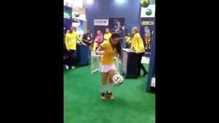 Hot girl doing amazing soccer tricks in a Brazil shirt