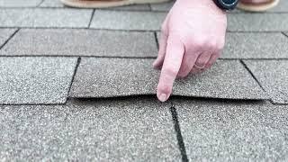 Why are shingles curling and nails popping on your roof?