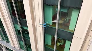 KTV Working Drone England cleaning windows on stunning building