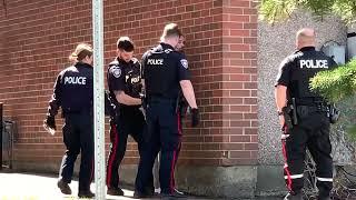 Ottawa police apprehending a stabbing suspect.