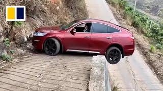 Chinese driver skilfully manoeuvres car on narrow road