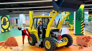 Sofia and Max play at the Children's Center and ride a tractor