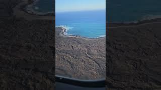 Blue ocean and lava rock on the coastline of Kona, Hawaii.