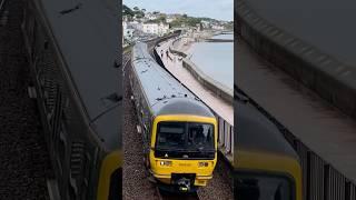 GWR class 166 clattering down the seawall into Kennaway tunnel on the Exmouth service 166208 DMU