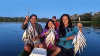 RIVERINE WOMEN IN SARDINE FISHING IN THE AMAZONAS