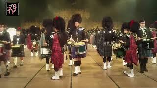 This is the sound of Scotland: massed bagpipes, drums and a castle