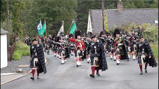 Lonach Highlanders march through Strathdon in the Cairngorms, Scotland during 2023 Lonach Gathering