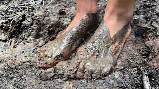 Olga walking barefoot through deep mud and smelly puddles, barefoot in mud, muddy feet (# 1494)