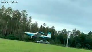 Motorist's video shows plane land along Tampa road