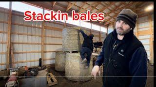 Rollin,flippin and stacking round bales making space