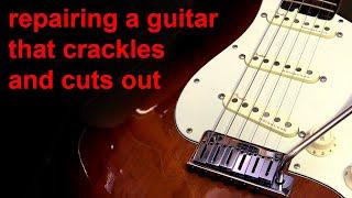 how to fix an electric guitar that crackles and cuts out (lead and jack)