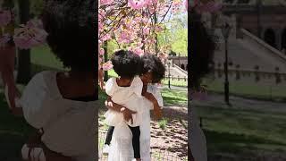 A Captivating Sight: Mother and Daughter Delight in Blossoming Flowers