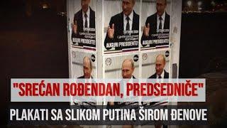 Na ulicama Đenove osvanulo na stotine plakata sa Putinovim portretom i porukom