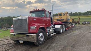 Trucking, Clearing, and Digging with Cat 215 Excavator