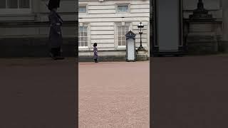 People marching in hats from Buckingham Palace London￼￼