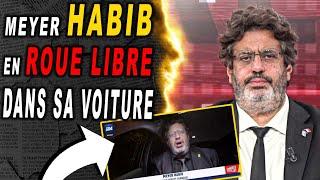 Meyer HABIB en roue libre au fond de sa voiture