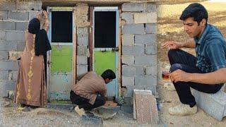 Installing bathroom doors with the collaboration of Masoud and Zahra