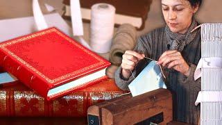 Handmade book and its artistic binding. Sewn and glued from paper and to a cover