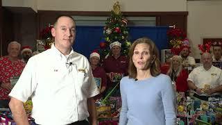 Les Schwab Tire Centers Manager Jeff Robidou and Community Works Executive Director Barbara Johnson