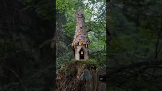 A fairy house crafted from a recycled bottle