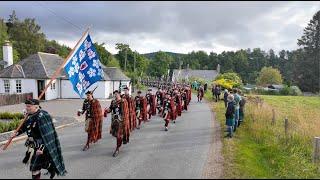 2024 Lonach Highlanders Gathering march through Strathdon in the Cairngorms National Park, Scotland