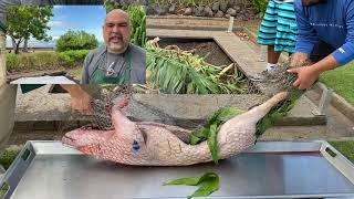 Chef Eddie cooking kalua pig in an imu.