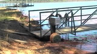 LazyDock Mover with winches moving dock in and out of water