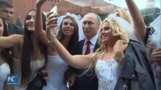 Wow! Putin mobbed by models in wedding dresses