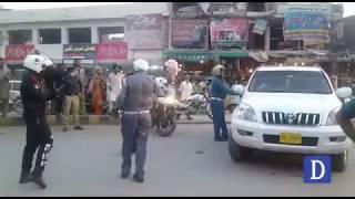 Lahore traffic wardens and Dolphin Force workers are hitting the car