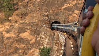 Goa express going up Braganza ghat section through Dudhsagar falls.