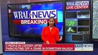 Two parachute off crane in downtown Raleigh, police say