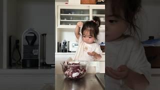 Japanese baby helps mom in the kitchen