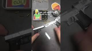 I guess you will like this mini Glock keychain with bullets