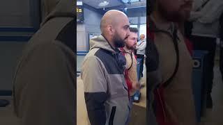 A officer draws his pepper spray in stratford station after a pro Palestinian demo