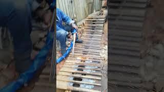 MELTING DOWN STEEL BOLT'S HEAD ON EXCAVATOR'S CHAINS TRACK FRAME WITH TORCH TO FIX WHEELS MOTION