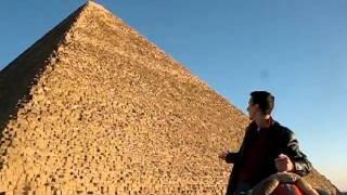 At Khufu's great Giza pyramid riding a camel