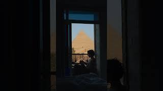 A Moment of Calm: Reading by the Pyramids 