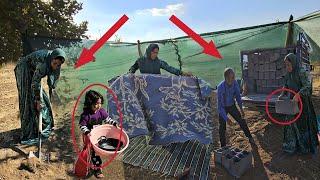 Setting up a tent in the desert by a nomadic woman after separating from her husband