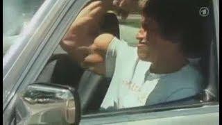 Arnold Schwarzenegger - Flexing Biceps In The Car