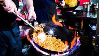 Chinese Street Food -Special wok fried twisted noodles with eggs, plum blossom cake， stir-fried pork