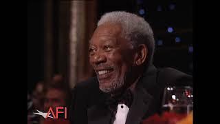 Betty White surprises Morgan Freeman at AFI awards.