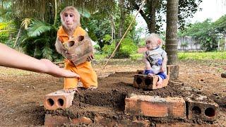 Bibi carries bricks to help Dad build the kitchen!